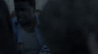 a blurry photo of a man in a white shirt