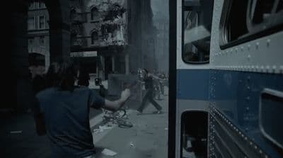 a man walking down a street next to a bus