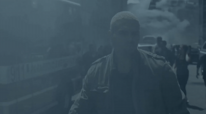 a man walking down a street in the fog