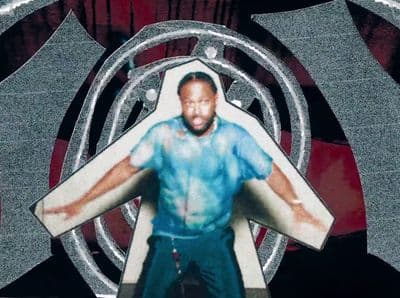 a picture of a man standing in front of a circular object