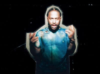 a man in a blue hoodie is holding something