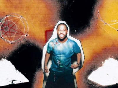 a picture of a man standing in front of a painting