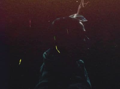 a blurry photo of a person in the dark