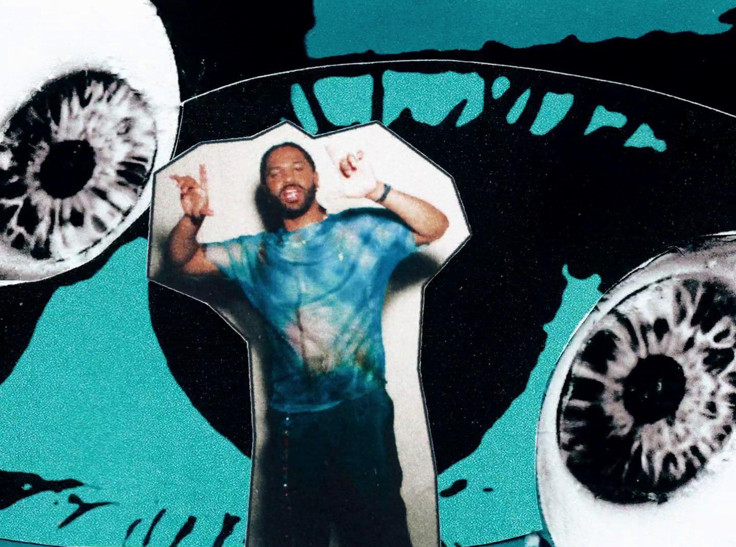 a man standing in front of a picture of his eyes