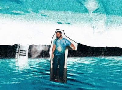 a man standing in the middle of a body of water