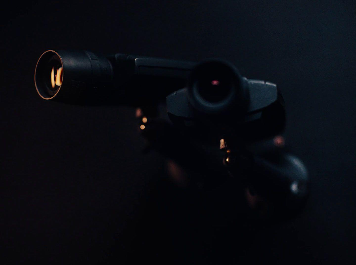 a close up of a camera lens on a tripod