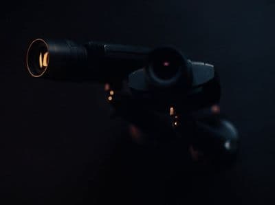 a close up of a camera lens on a tripod