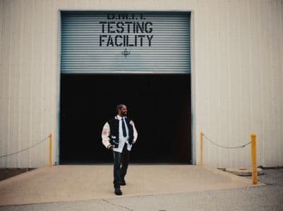 a man is standing in front of a building