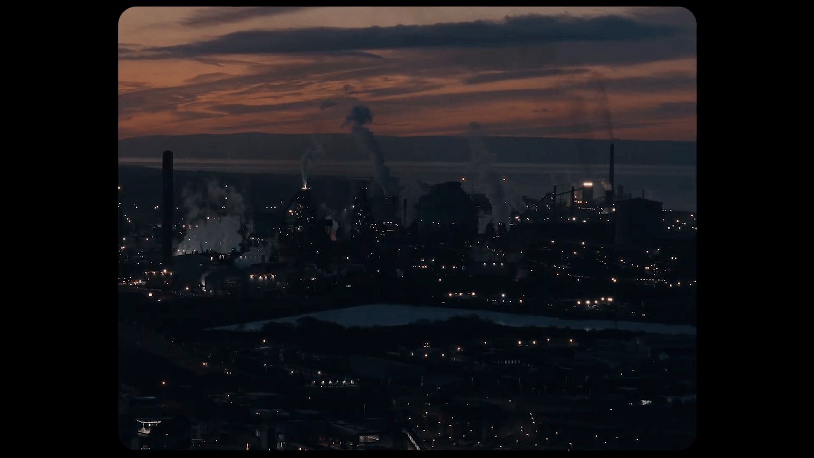 a view of a city at night from the top of a building