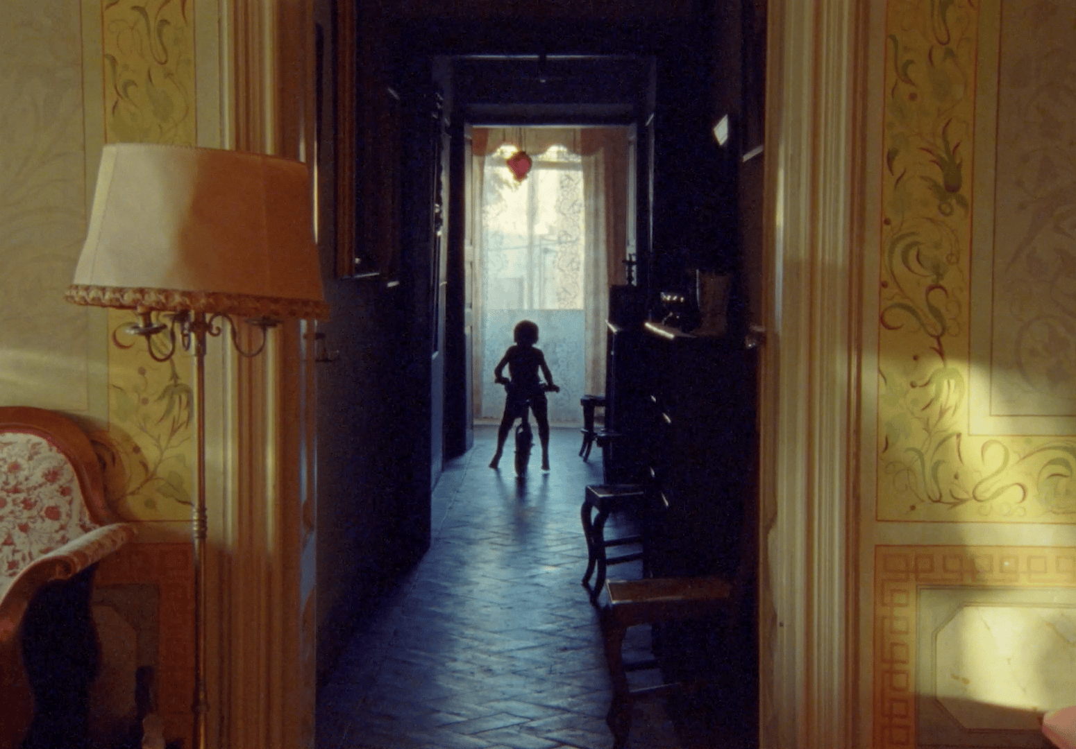 a person standing in a doorway of a house