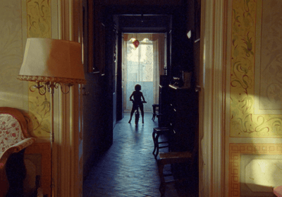 a person standing in a doorway of a house