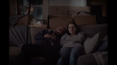 a man and a woman sitting on a couch