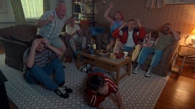 a group of people sitting around a living room