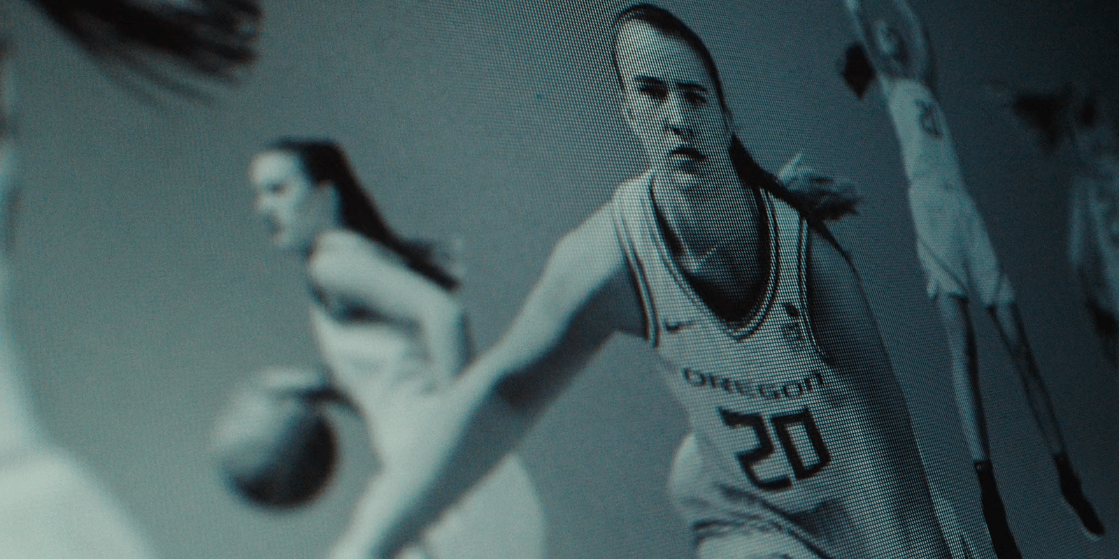 a man in a basketball uniform holding a basketball