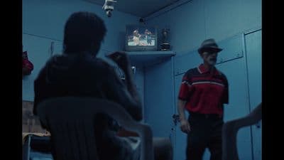 a man standing in front of a tv in a room