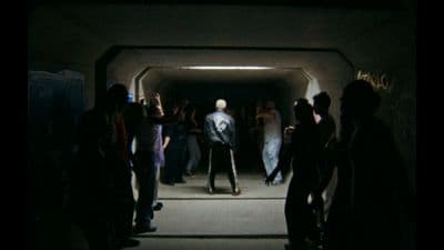 a group of people standing in a tunnel