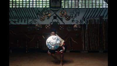 a man holding a soccer ball in his hands