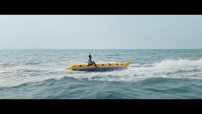 a person on a yellow boat in the ocean