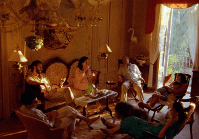 a group of people sitting around a living room