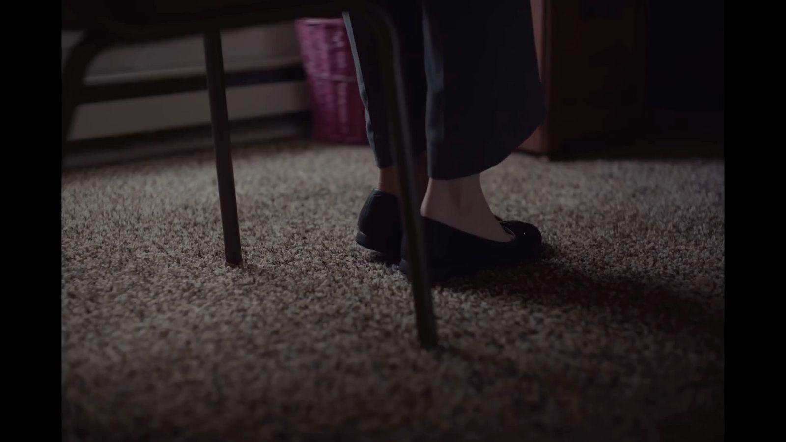 a person sitting on a chair in a room