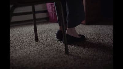 a person sitting on a chair in a room