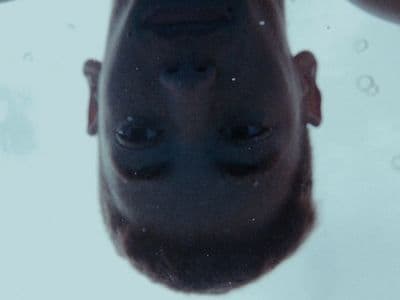 a close up of a man's face and nose