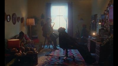 a group of people playing instruments in a room