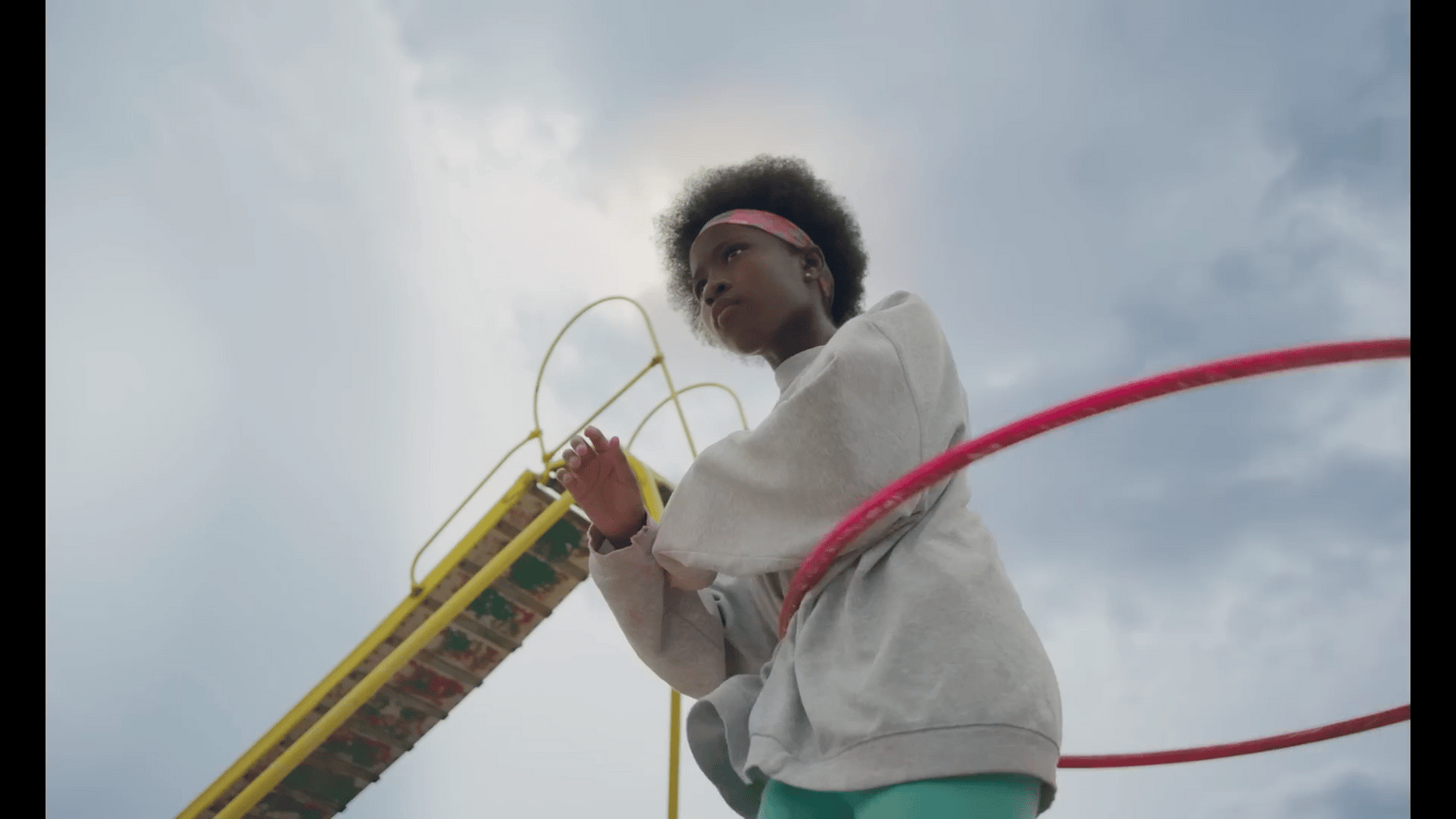 a young girl is playing with a toy