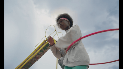 a young girl is playing with a toy