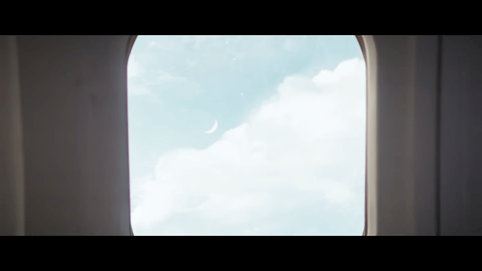 an airplane window with a view of the sky