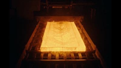 a large piece of metal being made in a factory