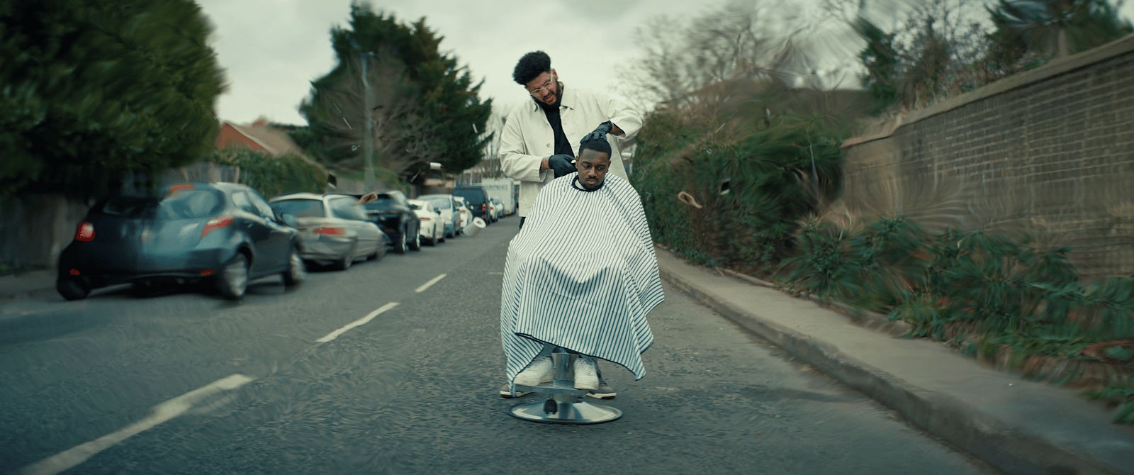 a man riding a skateboard down a street