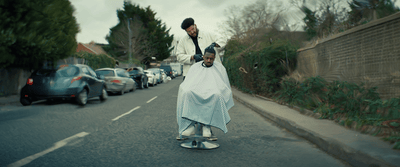 a man riding a skateboard down a street