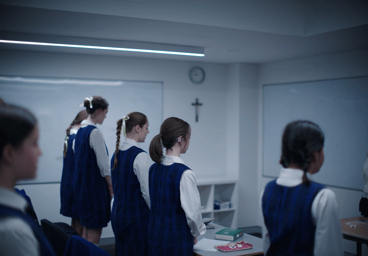 a group of young girls standing in front of a whiteboard