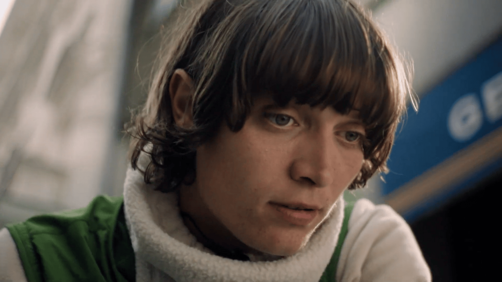 a man with a scarf around his neck