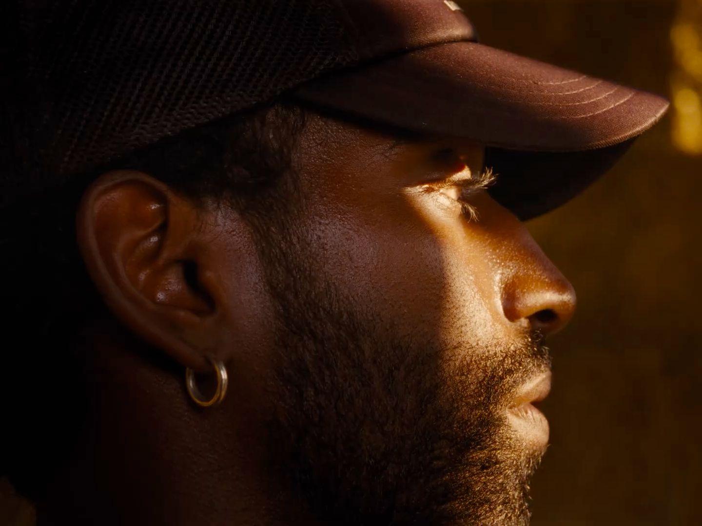 a close up of a person wearing a hat