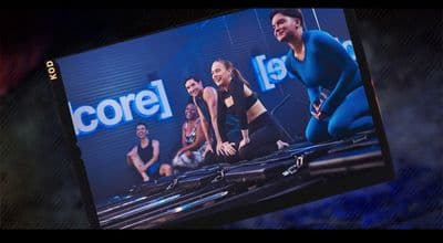 a television screen showing a group of people doing exercises