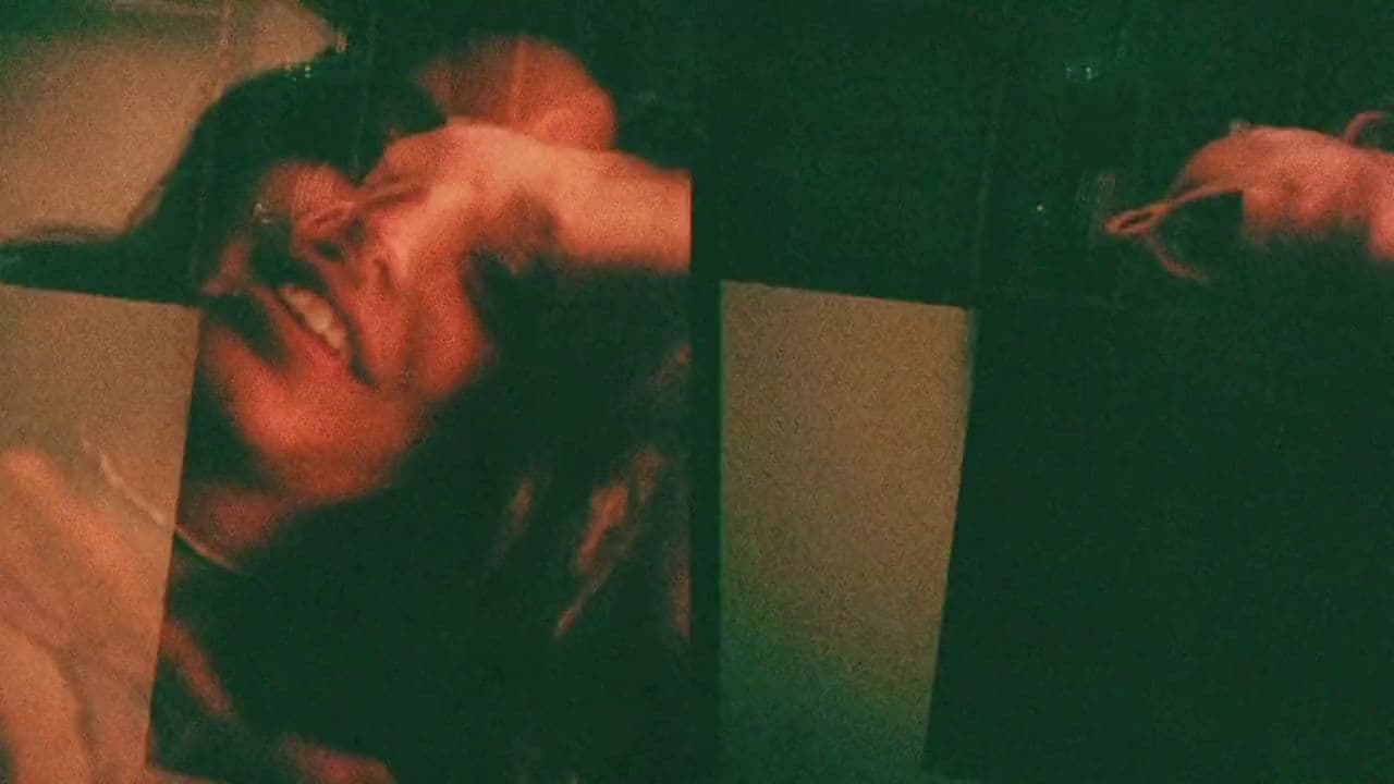 a woman laying down next to a cat