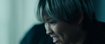 a close up of a person with a cell phone