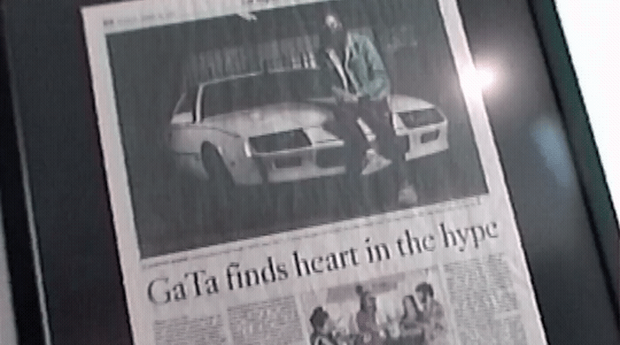 a picture of a man standing next to a car