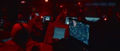 a room filled with lots of computer monitors