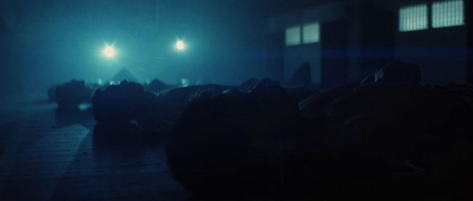a group of people standing in a dark room