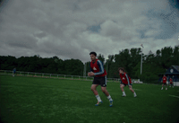 a group of young men playing a game of frisbee
