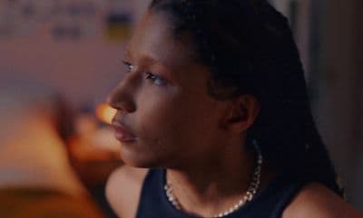a close up of a person wearing a necklace