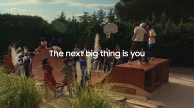 a group of people standing on top of a basketball court