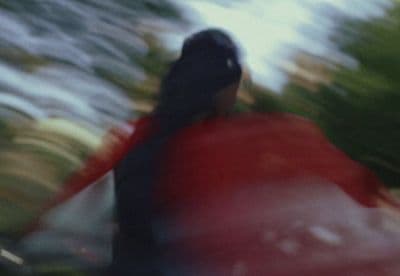 a blurry photo of a person riding a surfboard