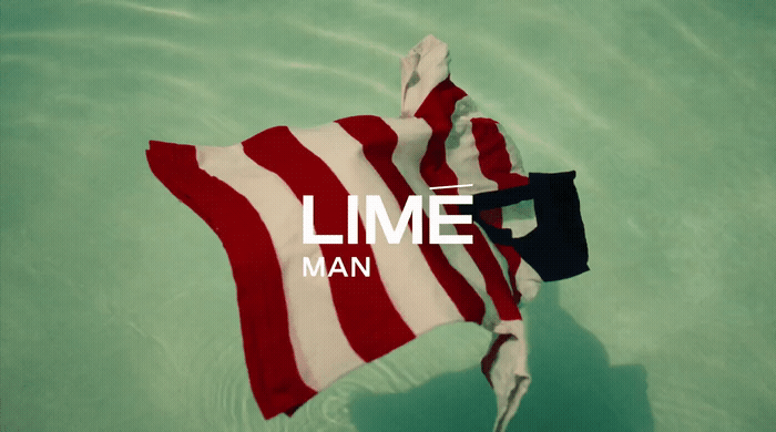 a red and white flag floating in a body of water