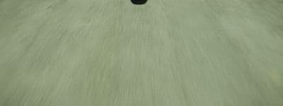 a person riding a skateboard down a street
