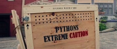 a wooden box with a sign that says python's extreme caution