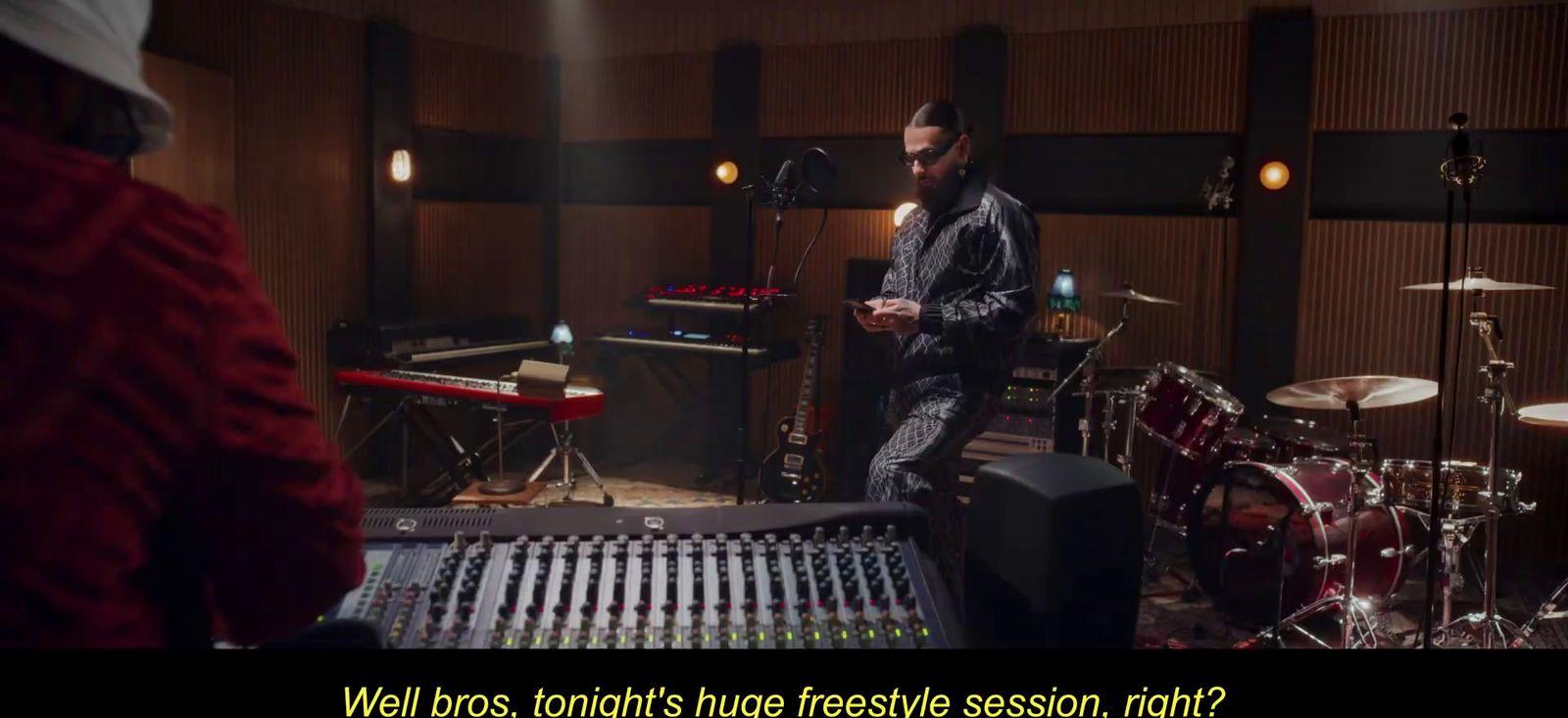 a man standing in front of a recording equipment